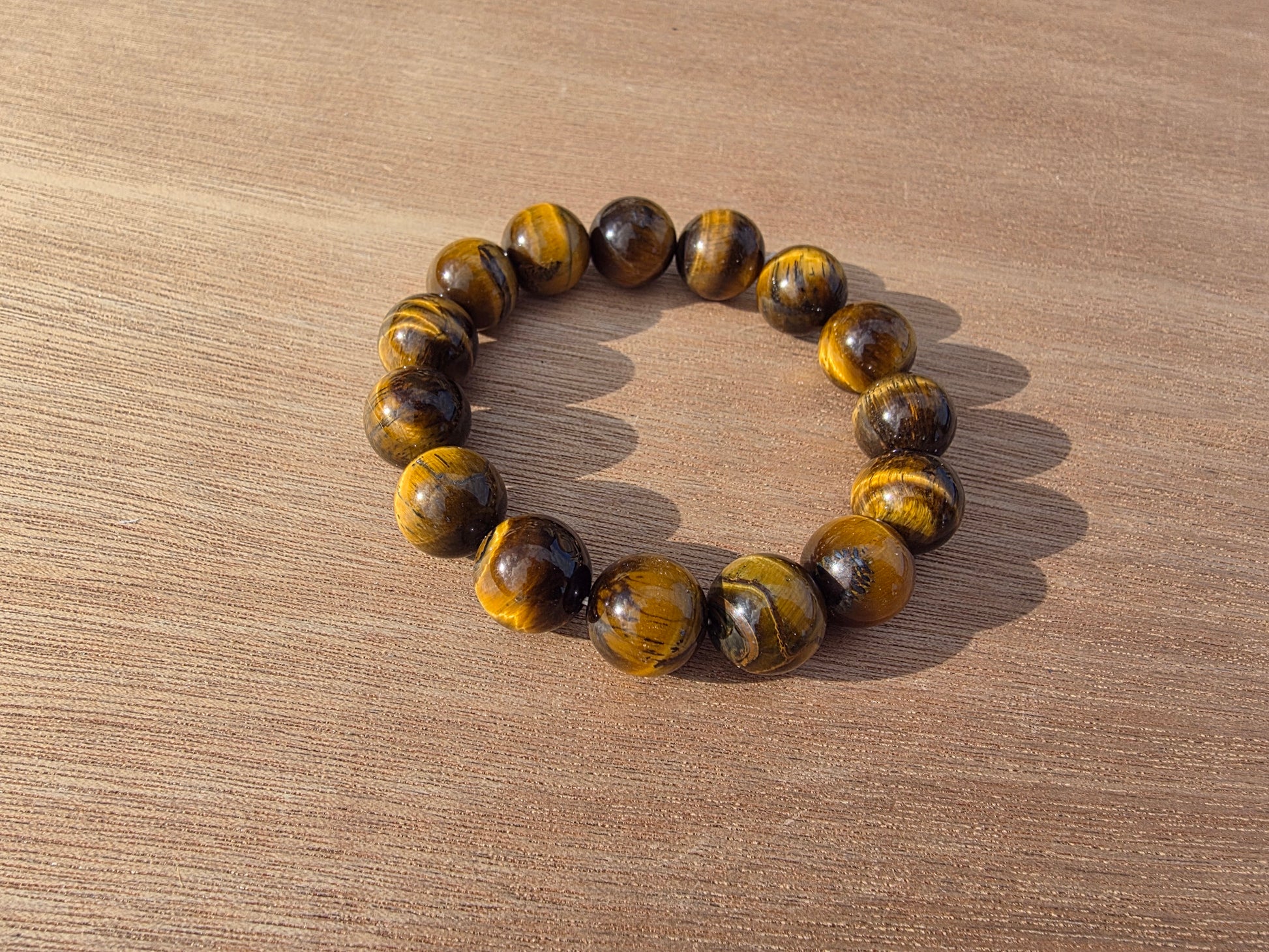 Bracelet en Oeil de tigre de perles de 14mm Cristal Roche