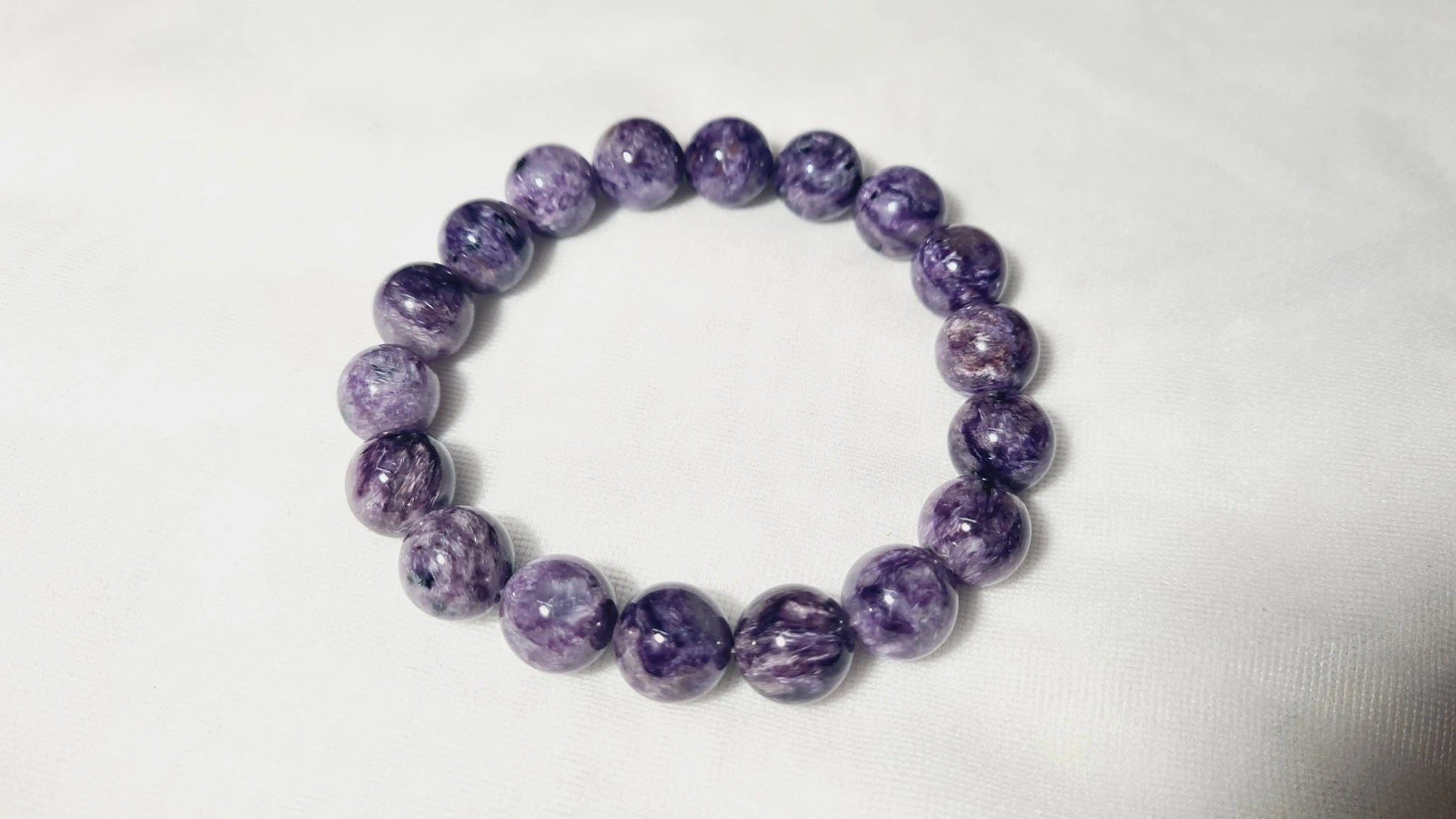 Bracelet en perles de charoïte 12mm / 21.6cm Cristal Roche